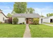 Charming home with well-maintained lawn and front yard landscaping at 916 S Outer Dr, Lebanon, IN 46052