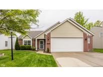 Lovely one-story home with attached two-car garage and well-maintained lawn at 12328 Slate Dr, Fishers, IN 46037