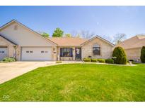 Charming single-story brick home with a well-kept lawn and attached two-car garage at 188 Bay Ridge Dr, Pendleton, IN 46064