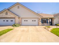 Charming brick home with a two-car garage, neat landscaping, and inviting front entrance at 188 Bay Ridge Dr, Pendleton, IN 46064