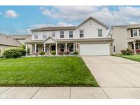 Charming two-story home with a well-manicured lawn and a welcoming front porch at 450 Columbia Ct, Greenwood, IN 46142