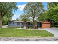 Charming single-story home with a blue exterior, landscaped yard, and a welcoming front porch at 6348 W 750 N, McCordsville, IN 46055