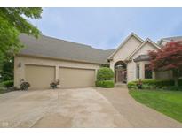 Charming two-story home with a three-car garage, landscaped yard, and a welcoming brick facade at 1614 Rosebud Ln # 83, Greenwood, IN 46143