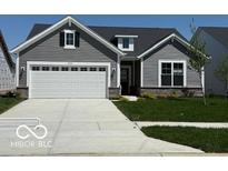 Charming single-Gathering home with gray siding, a two-car garage, and well-manicured front lawn at 19725 Highclere Lane, Sheridan, IN 46069