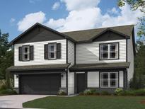 Charming two-story home featuring a black garage door, contrasting trim, and a well-manicured lawn at 2039 Quail West Dr, Danville, IN 46122