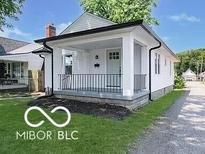 Charming one-story home with a welcoming front porch and well-maintained lawn at 426 St Paul St, Indianapolis, IN 46201