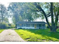 Charming home featuring a lush front lawn, mature trees, and inviting curb appeal at 503 Elmhurst Pl, Whiteland, IN 46184