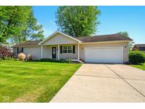 Charming ranch-style home with attached garage and well-maintained lawn, perfect for suburban living at 813 Stoner Dr, Anderson, IN 46013