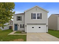 Charming two-story home featuring a well-maintained lawn and a two-car garage at 8158 S Firefly Dr, Pendleton, IN 46064