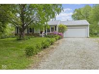 Charming home with stone accents, attached garage, and a well-maintained front yard at 8513 S 575 W, Morgantown, IN 46160