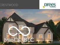 New two-story home featuring a symmetrical design, brick exterior, and a dark roof adding character to the architecture at 9602 Fall Creek Rd, Indianapolis, IN 46256