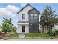 Charming two-story home with a modern design and well-manicured lawn at 1231 Marlowe Ave, Indianapolis, IN 46202