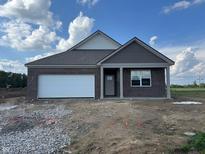 Charming single-story brick home with an attached garage and neutral-colored trim at 1266 Foxtail Ln, Greenwood, IN 46143