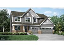Charming two-story home with gray siding, brick accents, and a two-car garage at 1239 Thornwood Dr, Greenwood, IN 46143