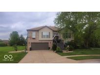 Beautiful two-story home with a well-manicured lawn and inviting front porch at 1714 Michelle Mnr, Danville, IN 46122