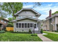 Charming two-story home featuring a cozy screened-in porch and well-maintained landscaping at 3918 N Park Ave, Indianapolis, IN 46205