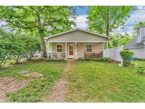 Quaint single-story home with a covered porch, brick accents, and a well-maintained yard at 4154 W Briarwood Lake S Dr, Monrovia, IN 46157