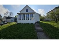 Charming home featuring a quaint front yard and multiple windows at 421 N Canal St, Alexandria, IN 46001