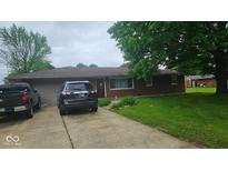 Charming single-story brick home with a well-maintained front yard and a two-car attached garage at 5805 S Gale St, Indianapolis, IN 46227