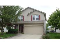 Charming two-story home featuring a two-car garage, neutral siding, and complementary red shutters at 8160 Whitham Dr, Indianapolis, IN 46237