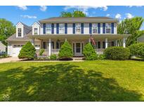 Charming two-story home with a large front porch and manicured lawn, offering a welcoming curb appeal at 10172 Watkins Ct, Indianapolis, IN 46234