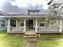 Inviting home featuring a covered front porch and classic architectural details at 1332 W 26Th St, Indianapolis, IN 46208