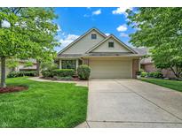 Charming single Gathering home with a manicured front yard and a two-car garage at 3033 Daum Ct, Carmel, IN 46033