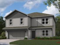 Two-story home featuring gray siding, a two-car garage, and professionally landscaped lawn at 1204 Mcbride St, Greenfield, IN 46140