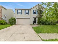 Charming two-story home with a well-maintained lawn, two-car garage and beautiful blue shutters at 2249 Blossom Dr, Greenwood, IN 46143