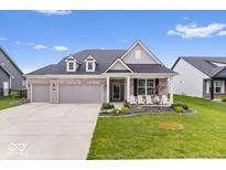 Charming single-Gathering home featuring a three-car garage and a welcoming front porch with comfortable seating at 3463 Sunnyvale Dr, Brownsburg, IN 46112