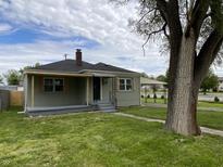 Charming home featuring a cozy front porch, well-maintained lawn, and appealing curb appeal at 453 Illinois St, Fortville, IN 46040