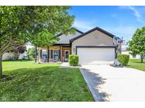 Charming single-Gathering home with a well-manicured lawn, two-car garage, and a cozy front porch at 5554 Jona Way, Bargersville, IN 46106