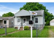 Charming exterior view of a cozy one-story home with a well-maintained lawn and an inviting entrance at 732 S Biltmore Ave, Indianapolis, IN 46241