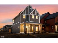 Beautiful two-story home with a charming front porch and modern design elements at 2024 Yandes St, Indianapolis, IN 46202