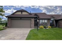 Charming single-story home with attached garage, brick accents, and well-maintained lawn at 326 Kilpatrick Ct, Edinburgh, IN 46124