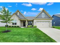 Charming single-story home boasts manicured lawn and stylish brick and siding exterior at 3592 Gillsland Rd, Bargersville, IN 46106