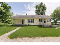 Charming one-story home with a well-maintained lawn and inviting front porch at 3642 S Mauxferry Rd, Franklin, IN 46131