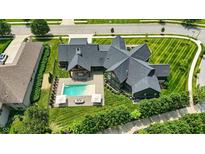A spacious backyard with a luxurious pool, perfect for outdoor entertaining and relaxation at 7116 Trail Ridge Ln, Indianapolis, IN 46259