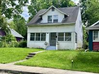 Two-story home featuring a well-maintained lawn, creating a welcoming curb appeal at 1137 W 34Th St, Indianapolis, IN 46208