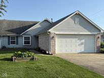 Charming single Gathering home with attached two car garage, and landscaped yard at 11523 Coastal Way, Indianapolis, IN 46229