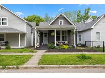 Charming single-Gathering home with a welcoming front porch and well-maintained landscaping at 1730 Hoyt Ave, Indianapolis, IN 46203