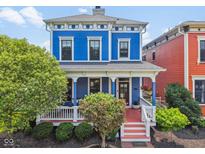 Charming blue two-story home with a welcoming front porch and well-manicured landscaping at 2191 Greencroft St, Carmel, IN 46032