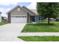 Charming single-story home featuring a front-facing garage, brick accents, and a well-manicured lawn at 2717 Arklow Way, Brownsburg, IN 46112