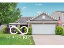 Charming single-story home featuring an attached two-car garage, landscaped yard, and a welcoming entrance at 2911 W Hawanian Ln, Monrovia, IN 46157