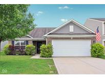 Charming home featuring a two-car garage, landscaped yard, and brick and vinyl siding at 2911 W Hawanian Ln, Monrovia, IN 46157