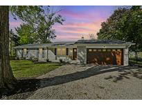 Charming brick ranch-style home with a two-car garage and a well-manicured front yard at 2956 N 700 E, Franklin, IN 46131
