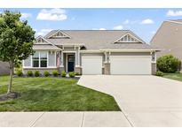 Charming single-story home with a well-manicured lawn, a two-car garage, and a welcoming entrance at 4428 Maldenhair Dr, Indianapolis, IN 46239