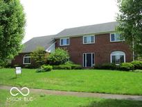 Traditional two-story brick home with well-maintained lawn and mature trees at 4667 Sundance Trl, Indianapolis, IN 46239