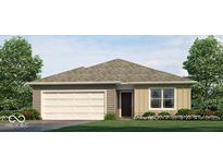 Charming single-story home featuring a two-car garage, neutral siding, and a well-maintained lawn at 5216 Cartland Dr, Indianapolis, IN 46239