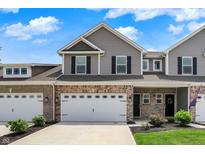 Well-maintained townhome with a brick and vinyl facade at 6463 Wasco Dr, Whitestown, IN 46075